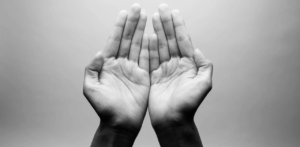 Close-up of open hands held together in a gesture of offering or meditation