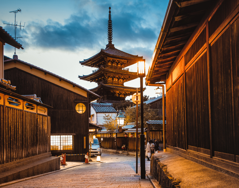 Traditional Japanese street with pagoda at dusk, highlighting cultural heritage, historic architecture, and serene travel destination